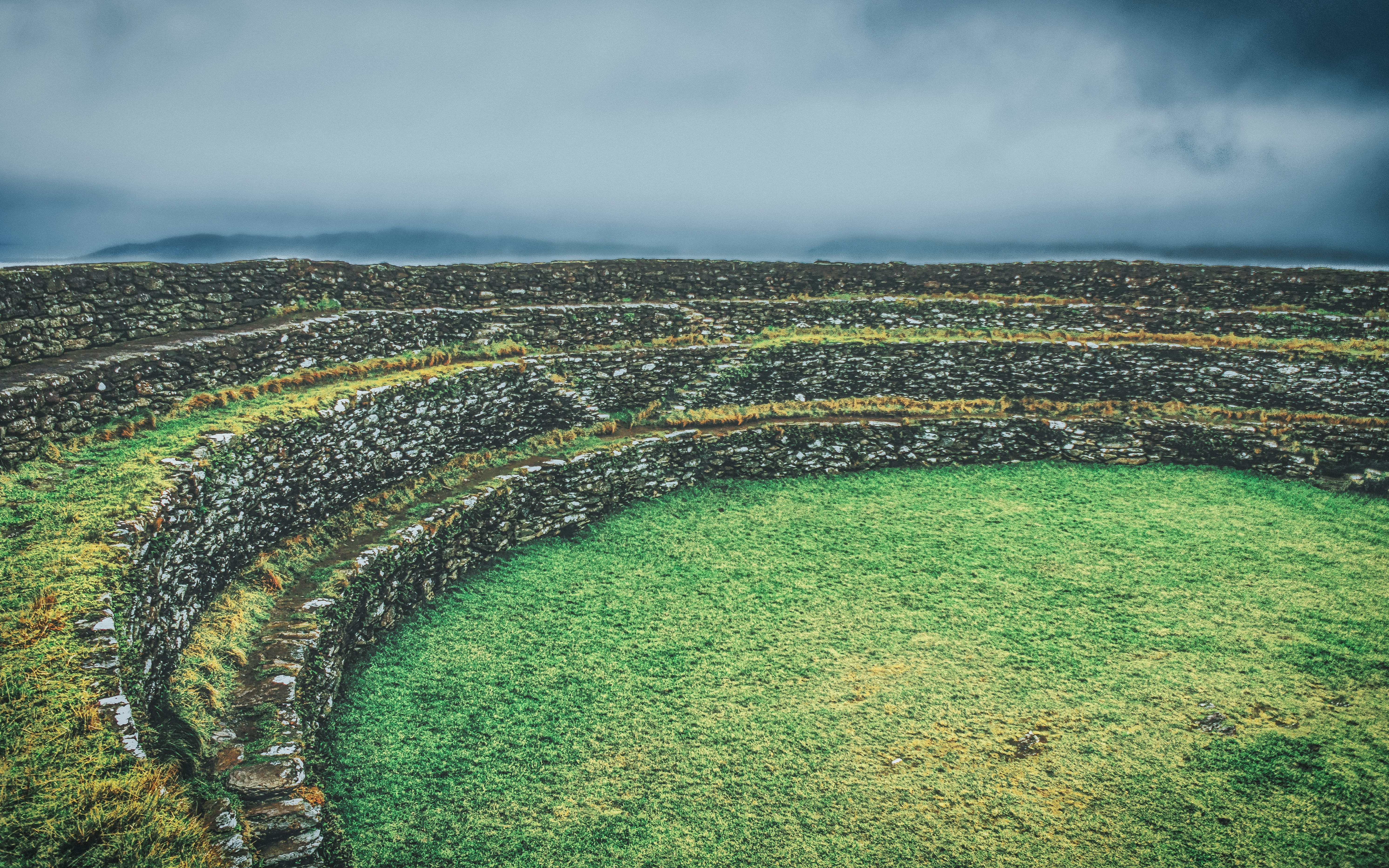 Emotional Neglect - Image of old tiered rock and grass theatre