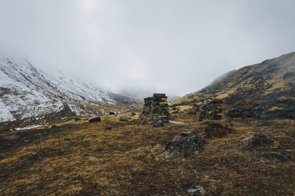 Emptiness of Emotional Neglect - image of a neglect start of a building on an empty mountainside